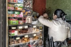 An LAPD cop at the snack counter of a Boyle Heights Mexican restaurant.