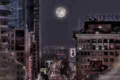 Angel over Hollywood and Vine with full moon.