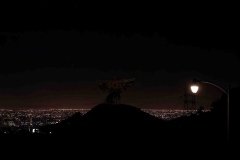 An angel lords over a blanket of LA lights.